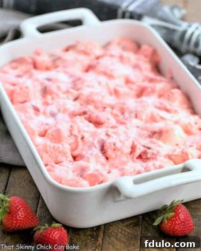 Strawberry Angel Food Dessert in a 9 x 13 inch rectangular ceramic dish