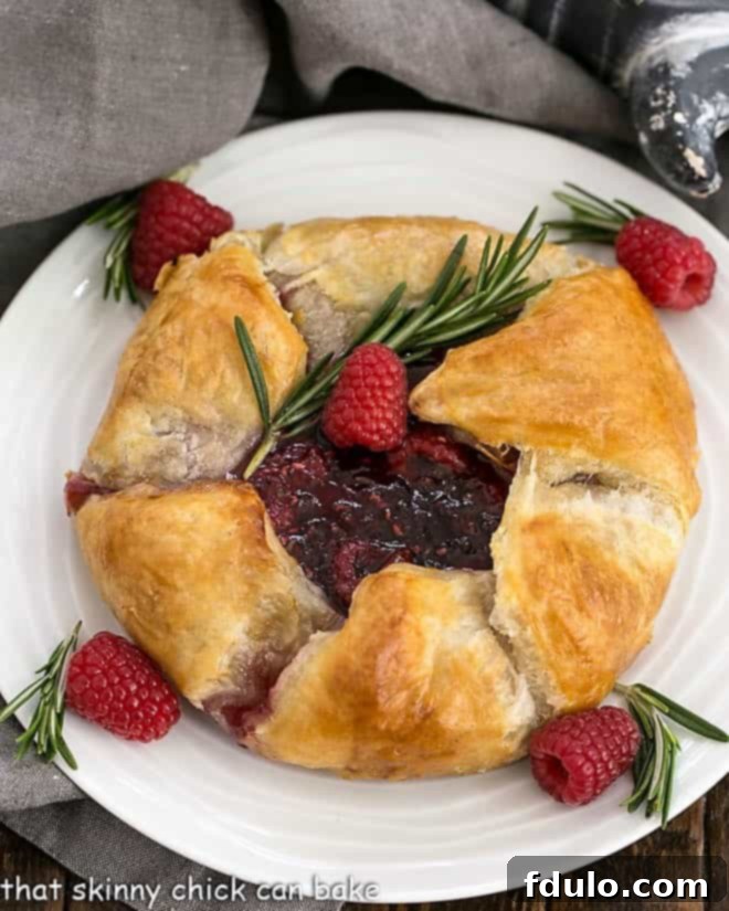 Overhead view of Raspberry Baked Brie en Croute, showcasing its golden crust and delicious filling.
