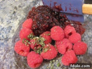 Raspberry Baked Brie Topping ingredients mixed in a bowl.