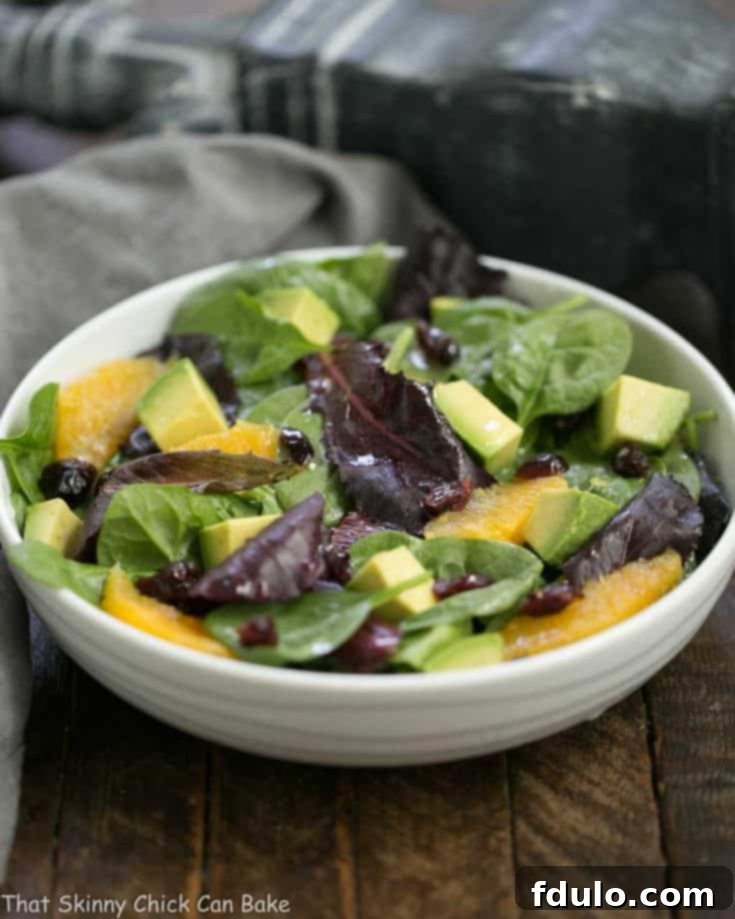 Sunny Citrus Avocado Spinach Salad 3 A tasty Citrus Spinach Salad with Avocados and Oranges, garnished with a vibrant lemon Dijon vinaigrette. A perfect light meal or side dish.