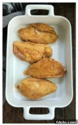 Step 1: Boneless, skinless chicken breasts coated lightly with seasoned flour.