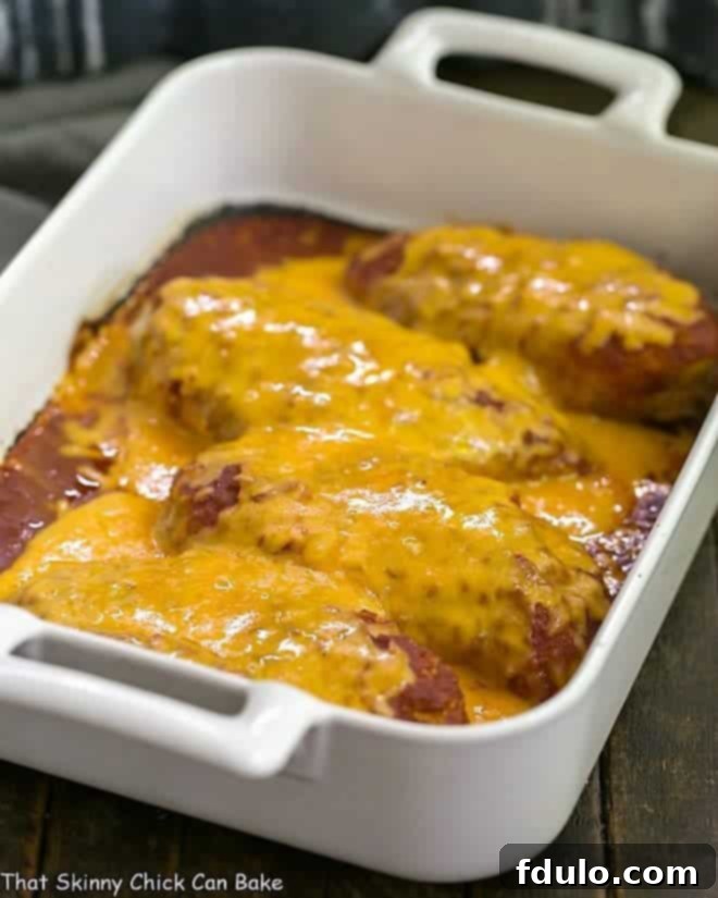 Easy Salsa Chicken baked in a white rectangular porcelain dish, garnished with fresh cilantro, ready to be served.