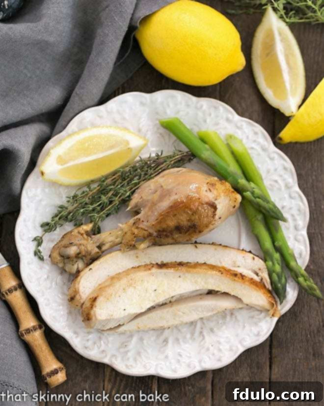 Overhead view of a plate of sliced Instant Pot Rotisserie Chicken, showcasing its juicy texture.