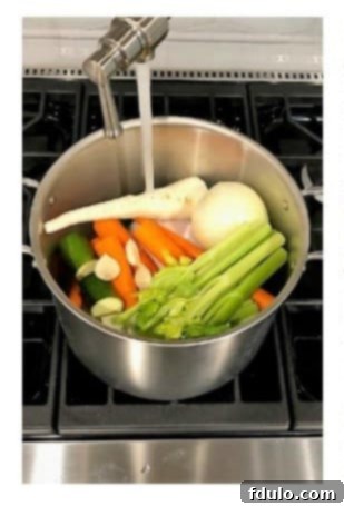 Cover chicken and vegetables with water in the pot.
