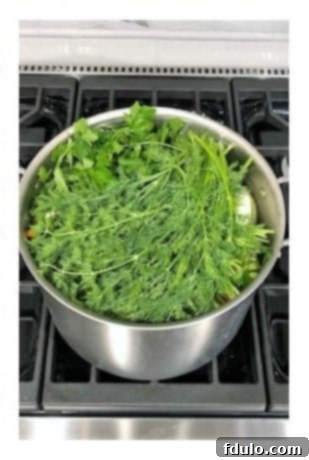 Simmer chicken soup with dill for 3 hours, then prepare chicken and vegetables for serving.