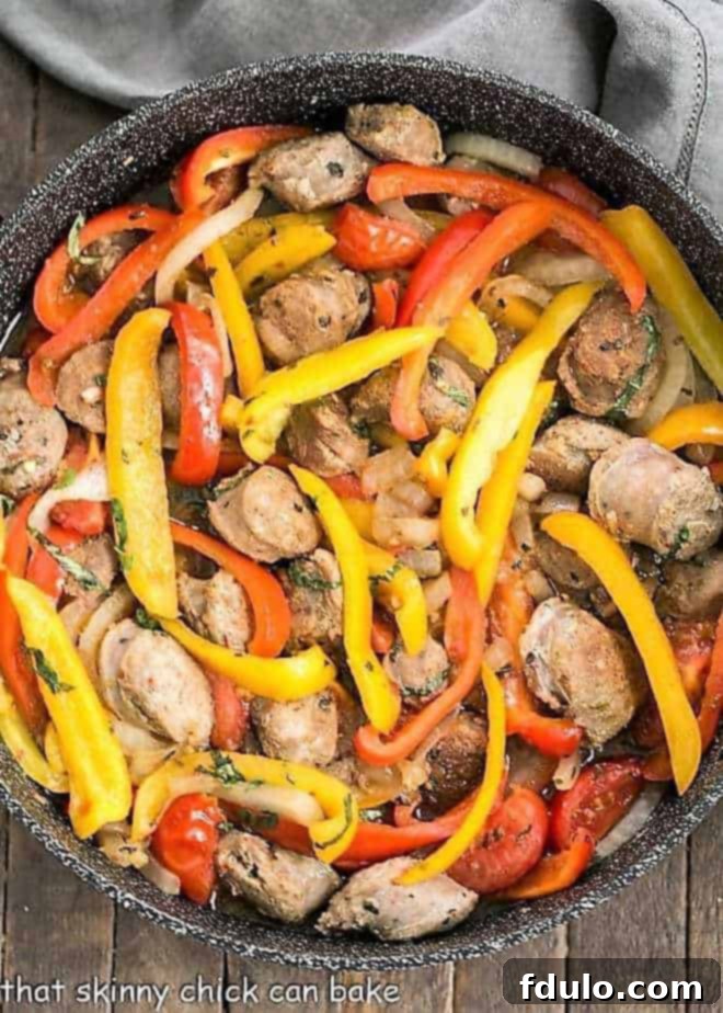 Italian Sausage and Peppers in a black skillet, showcasing vibrant colors and enticing textures