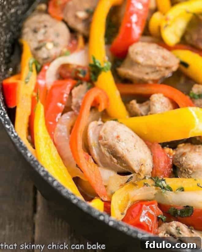 Close-up view of vibrant Italian Sausage and Peppers simmering in a skillet