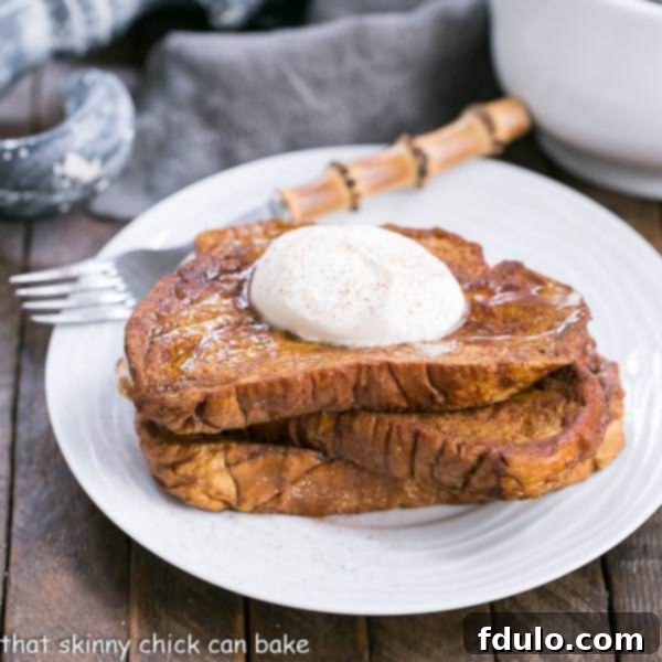 Pumpkin French Toast topped with fluffy mascarpone whipped cream and a sprinkle of cinnamon.