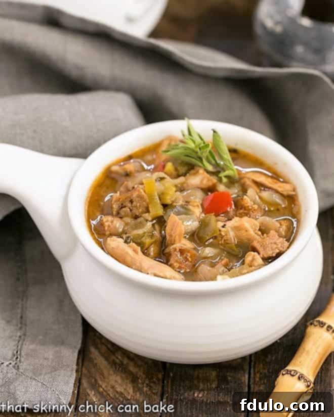 Sausage and Chicken Gumbo served in an elegant ceramic soup bowl, ready to be enjoyed.