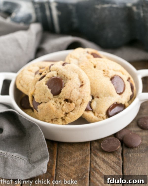 Thick and Chewy Chocolate Chip Cookies in a shallow handled dish.