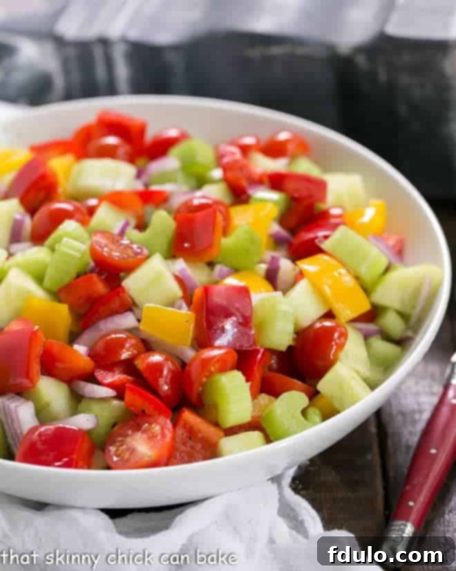 Marinated Vegetable Salad in a white serving bowl, showcasing vibrant vegetables.