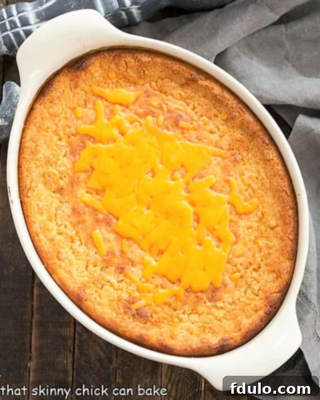 Unbaked Corn Casserole Recipe mixture in a white baking dish, ready for the oven.