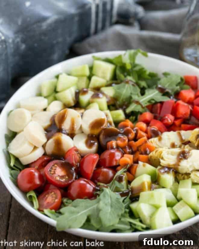 Quick Homemade Balsamic Vinaigrette 2 Easy Balsamic Vinaigrette on a vegetable salad in a white bowl