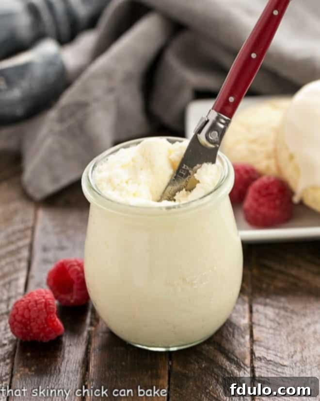 Super moist Vanilla Bean Scones glazed and served with clotted cream. Learn how to make scones in your own kitchen!