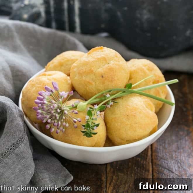 Bowl of cheese puff with chive and thyme garnishes