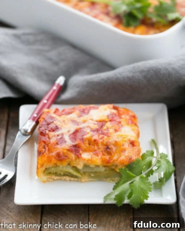 Chiles Rellenos Casserole | A super easy version of the classic Tex-Mex dish A serving of Chiles Rellenos Casserole on a plate, showcasing melted cheese and green chiles.