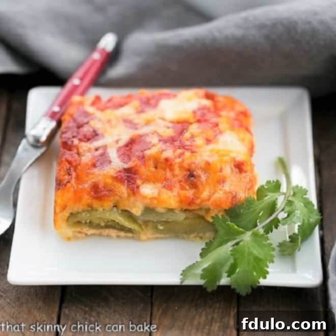 Chiles Rellenos casserole is a super simple Tex-Mex dish that is pure comfort food! This Easy Chiles Rellenos casserole recipe makes an easy weeknight dinner. Plated serving of Chiles Rellenos Casserole, garnished for enjoyment.