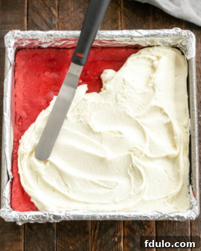 White Chocolate-Kissed Red Velvet Brownies 8 Brownies baked, cooled and frosting applies