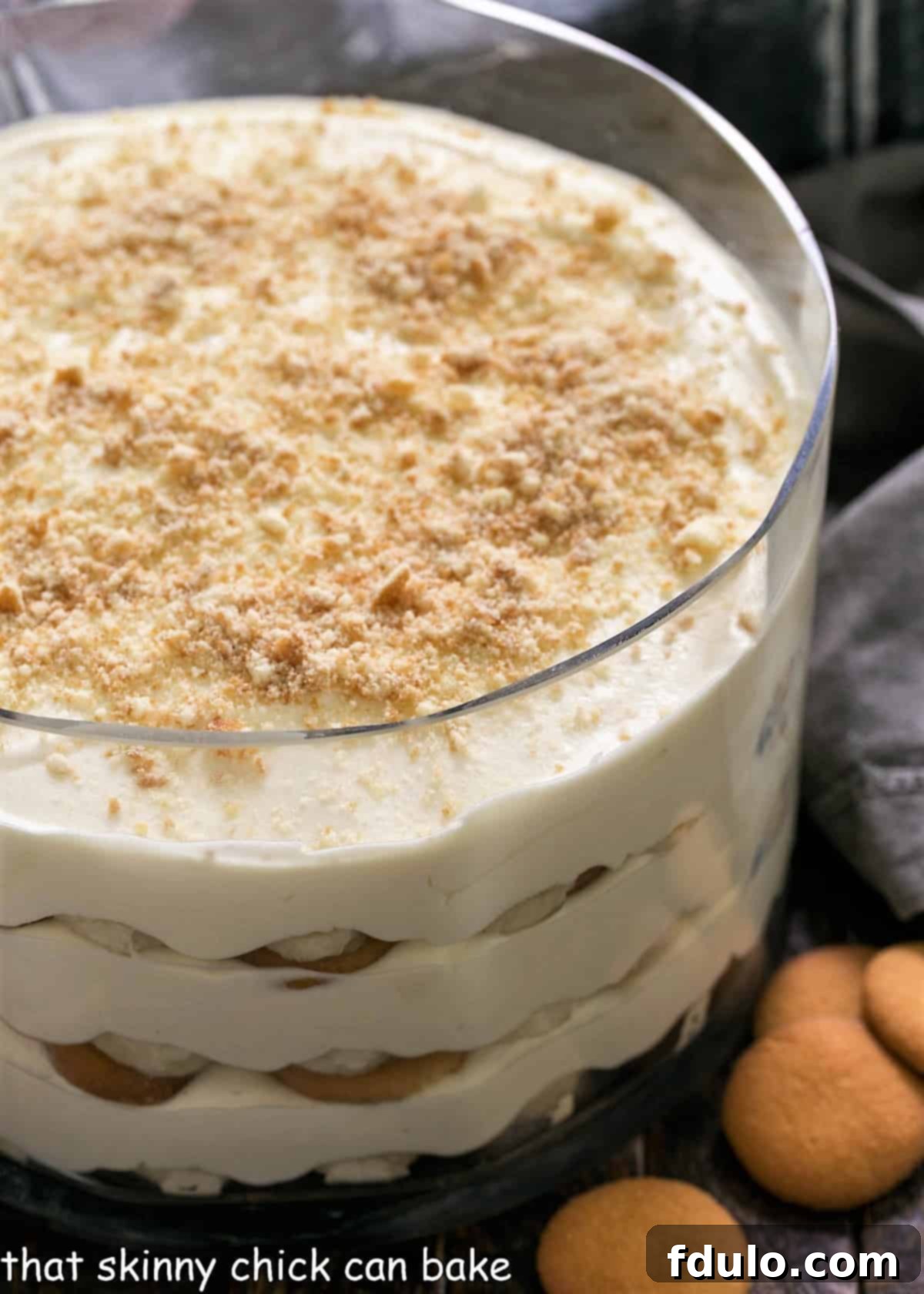 Easy Banana Pudding - a classic meringue topped vanilla pudding chock full of banana slices and a vanilla wafer crust. Easy banana pudding in a glass serving bowl.