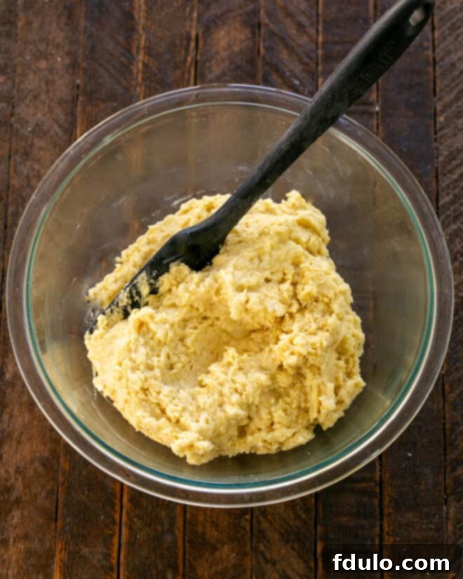 Dry ingredients mixed into wet ingredients.