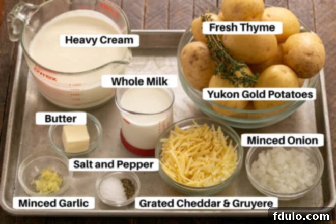 Scalloped Potatoes ingredients on a metal sheet pan with labels.