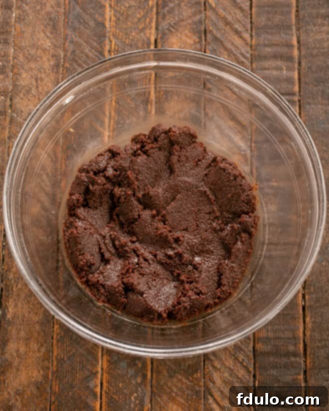 Step 3: Mix the sugar into the chocolate mixture until well combined.