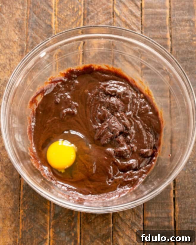 Step 4: Use a mixer to beat in the room temperature eggs one at a time.