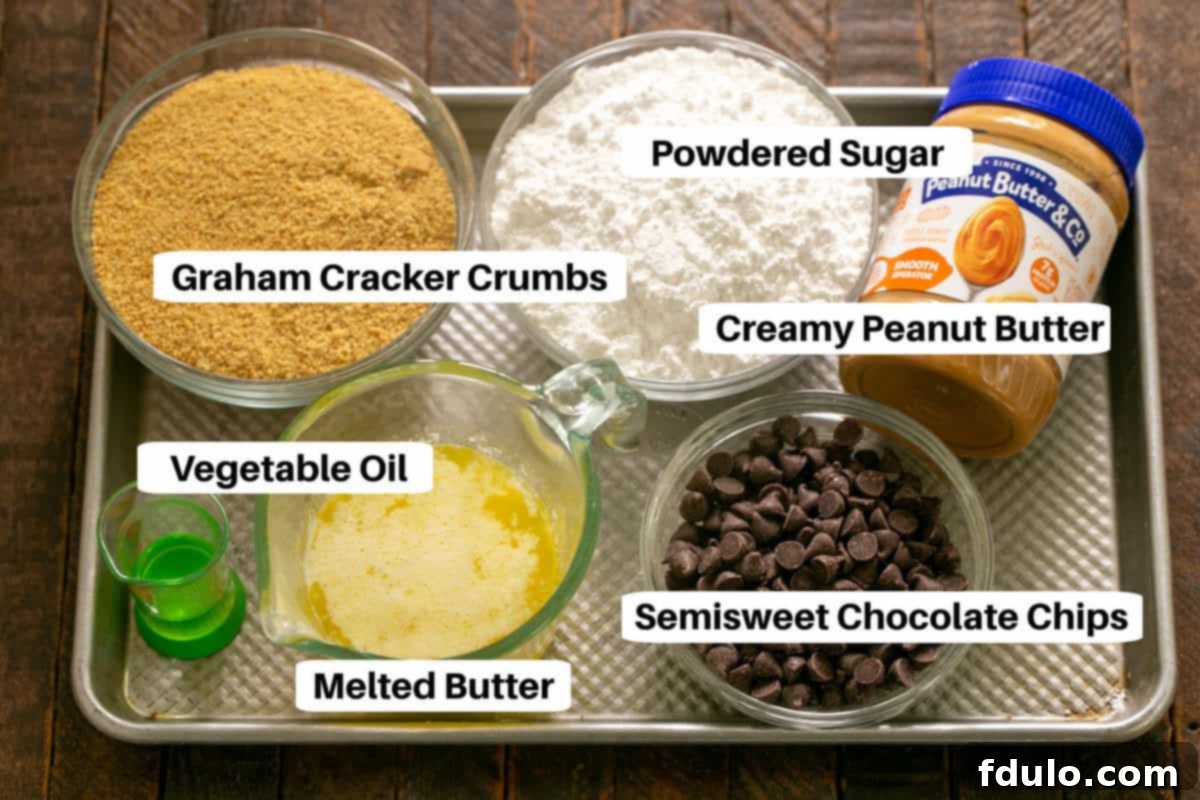 A selection of ingredients for Peanut Butter Bars, including butter, graham crackers, powdered sugar, peanut butter, and chocolate, neatly arranged on a sheet pan.