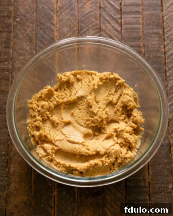 Step 3: Mixing the peanut butter bar ingredients until thoroughly combined into a uniform mixture.