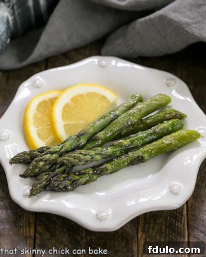 Easy Oven Roasted Asparagus on a white octagonal plate.