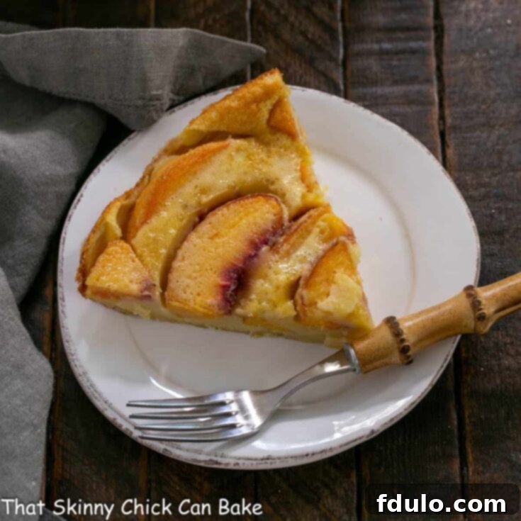 Luscious Peach Clafoutis 7 Overhead view of a slice of peach clafoutis, showing its golden crust and juicy fruit filling.