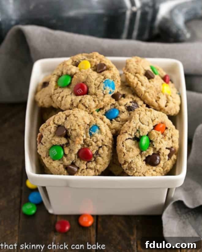 A ceramic basket overflowing with freshly baked Classic Monster Cookies, ready to be enjoyed.