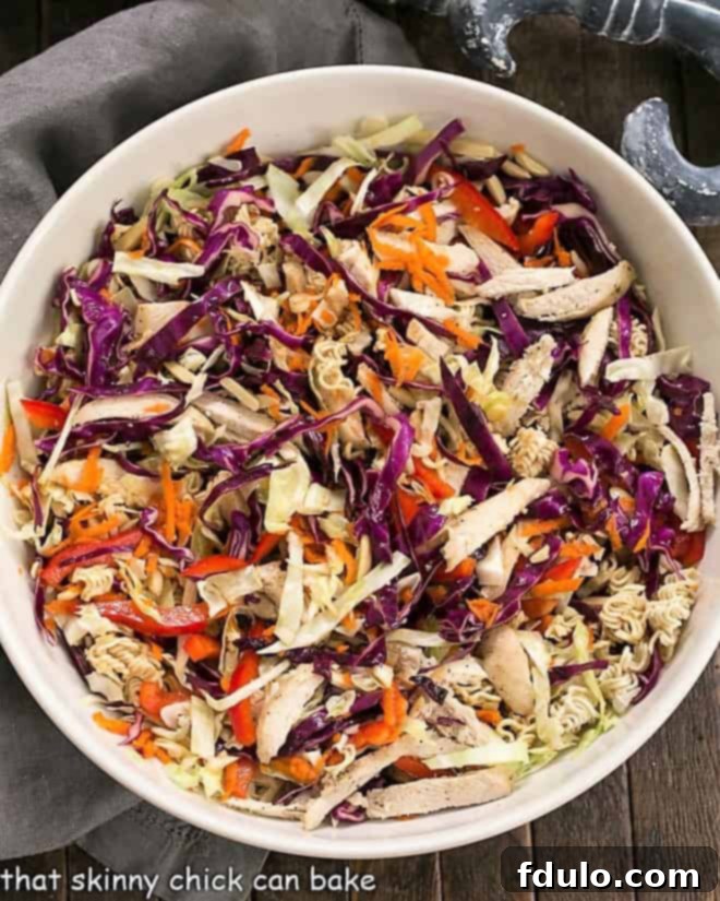 Overhead view of Asian Ramen Noodle Salad in a white serving bowl.