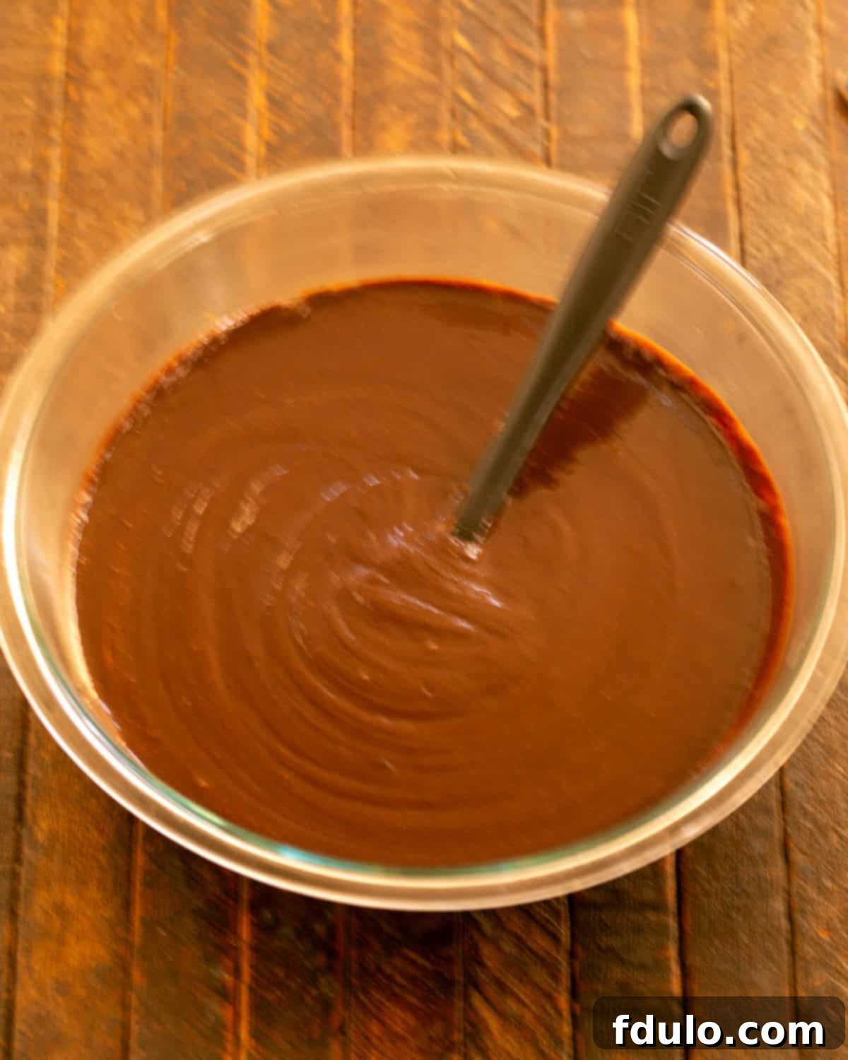 Step 4: Melted chocolate stirred into the egg mixture.