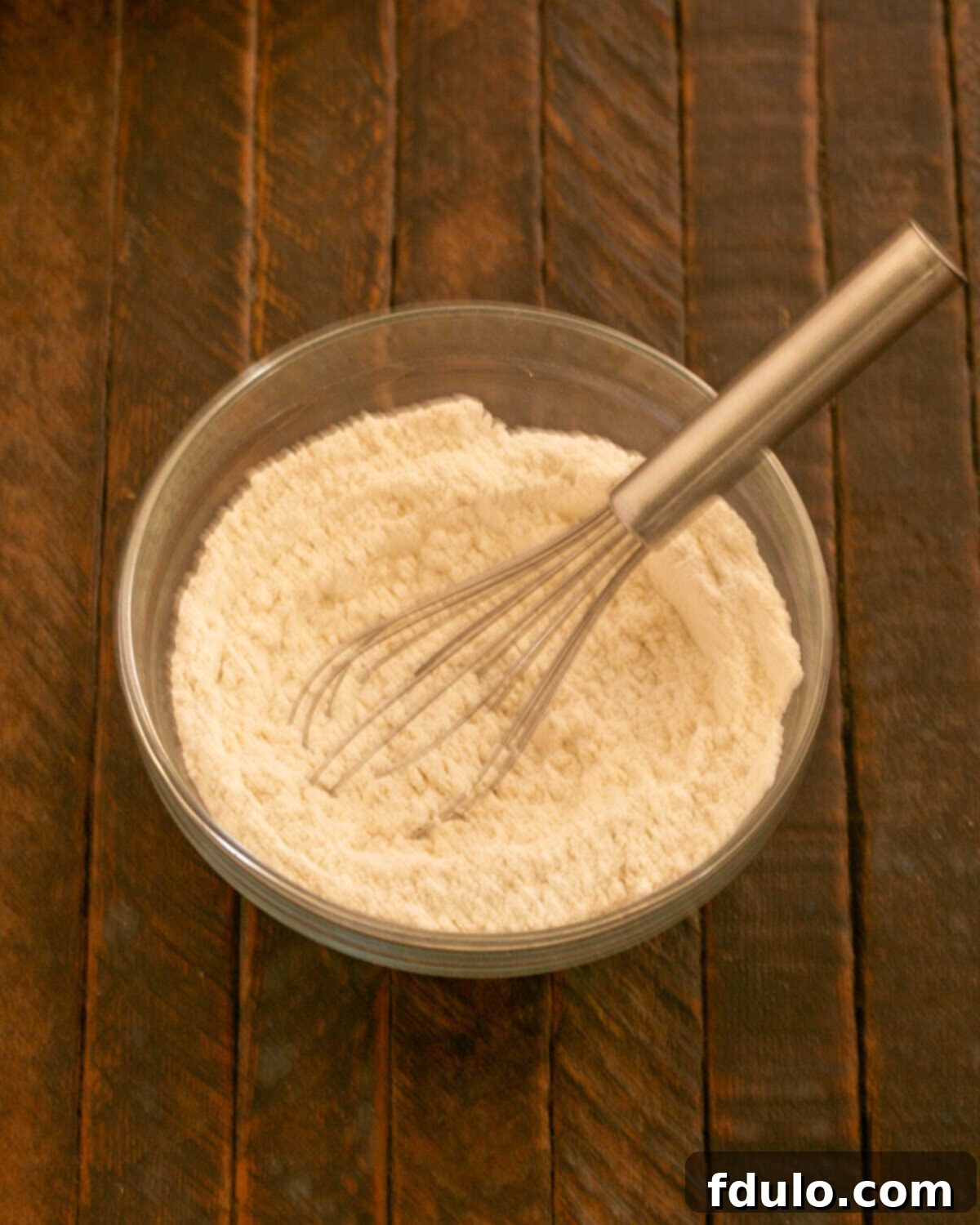 Step 5: Flour, baking powder, and salt whisked in a dry bowl.