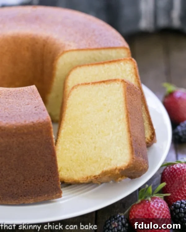 An array of Best Pound Cake slices artfully arranged on a elegant cake plate, showcasing its golden crust and moist interior.