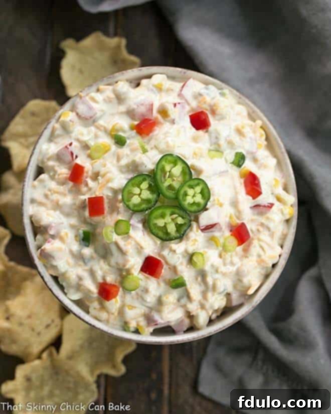 Sour Cream Corn Dip - The easiest party appetizer you'll ever make! Overhead view of Sour Cream Corn Dip in a round ceramic dish, ready to be served.
