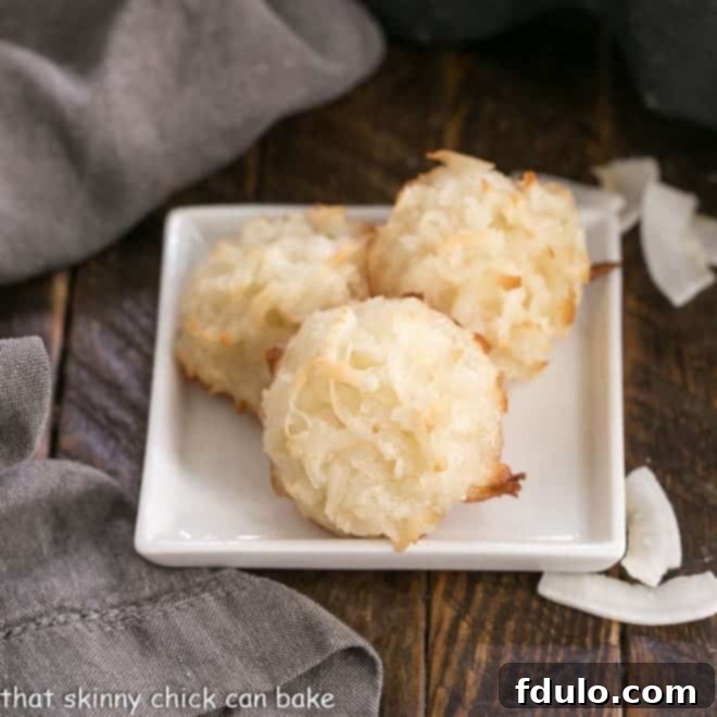 Classic Coconut Macaroons on a square white plate, perfectly golden and inviting.