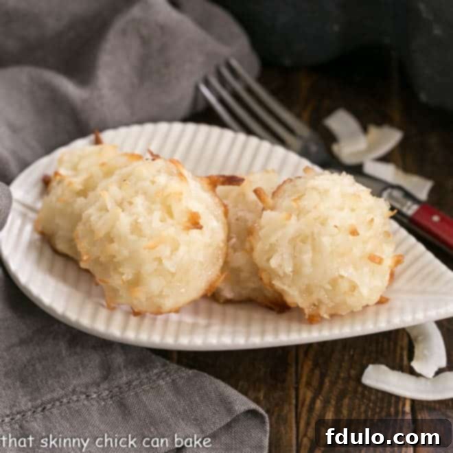 Assortment of Classic Coconut Macaroons on a leaf-shaped white plate, showcasing their inviting texture.