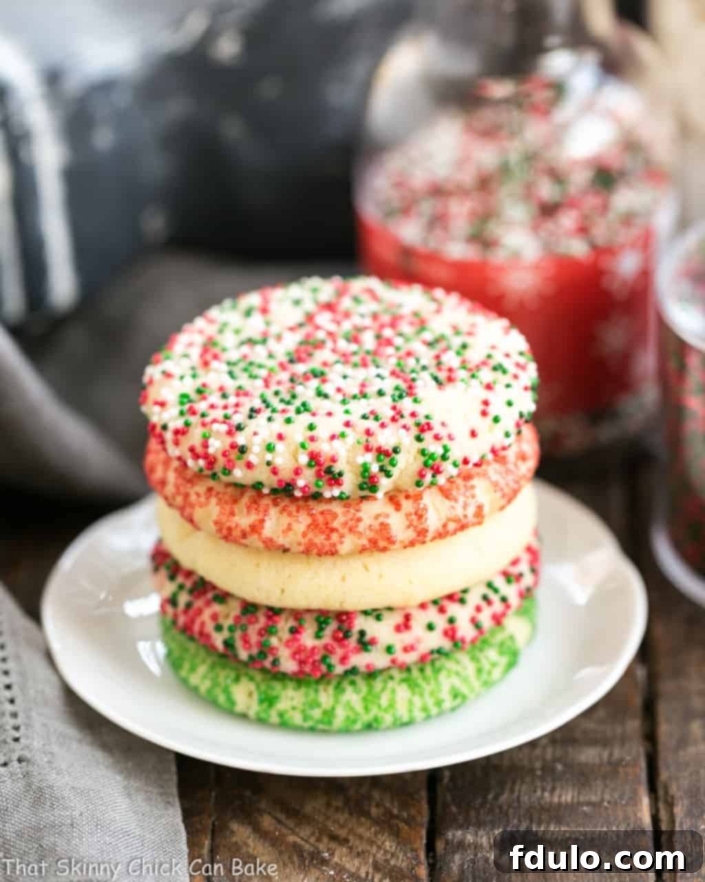 Old-Fashioned Amish Sugar Cookies stacked on a white plate.