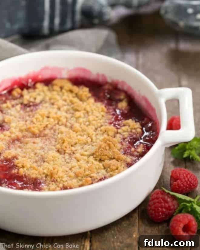 Fresh Raspberry Crisp in a round white casserole dish