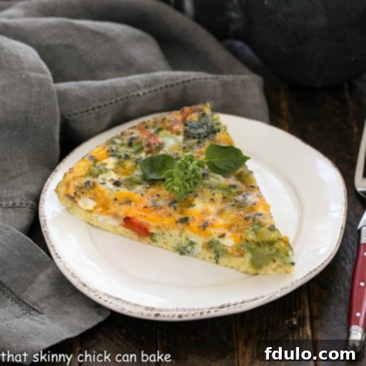 Roasted Broccoli Frittata slice on a round white plate