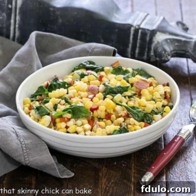 Vibrant Skillet Corn, Spinach, and Peppers 4 Skillet corn recipe in a white serving dish with a red handle spoon, presented beautifully