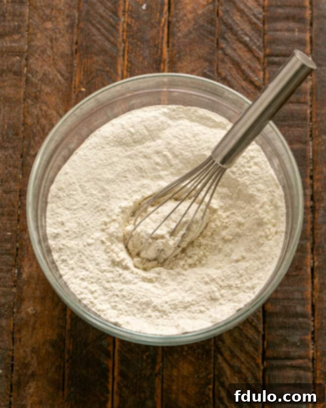 Step 1: Whisk together the dry ingredients – flour, baking soda, and salt in a bowl.
