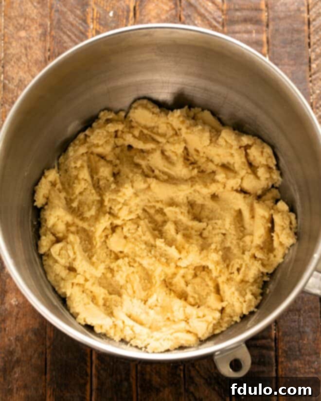 Step 4: Gradually add the dry flour mixture to the wet ingredients, mixing until just combined.