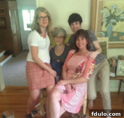 A heartwarming candid photo of sisters enjoying a moment together in their childhood home