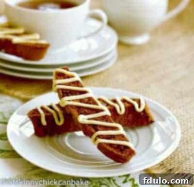 Beautifully arranged Gingerbread Biscotti on a round white plate, ready to be enjoyed.