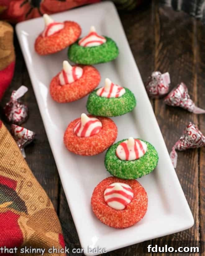 Overhead view of Candy Cane Blossoms on a white ceramic tray, showcasing their festive colors and shape.