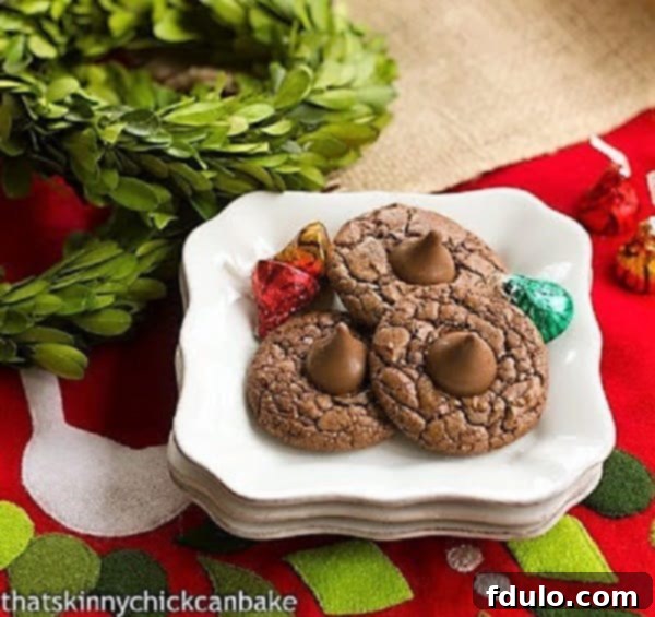 Double Chocolate Thumbprints on a stack of square white plates