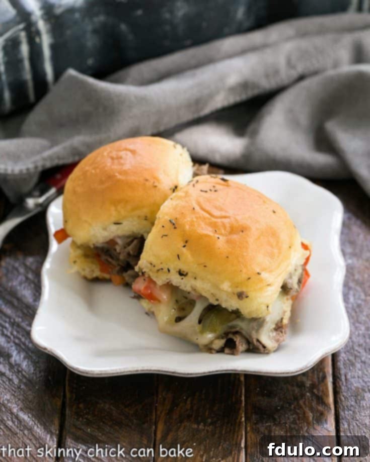 Two slider sandwiches on a small white ceramic plate, part of a recipe card